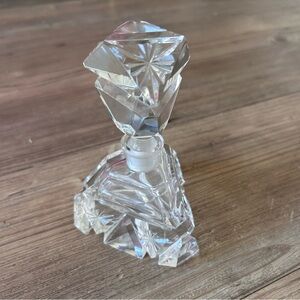 Vintage bohemian cut crystal perfume bottle, geometric art deco style.